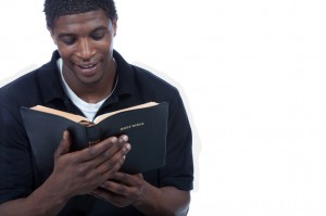 Young black man reading bible